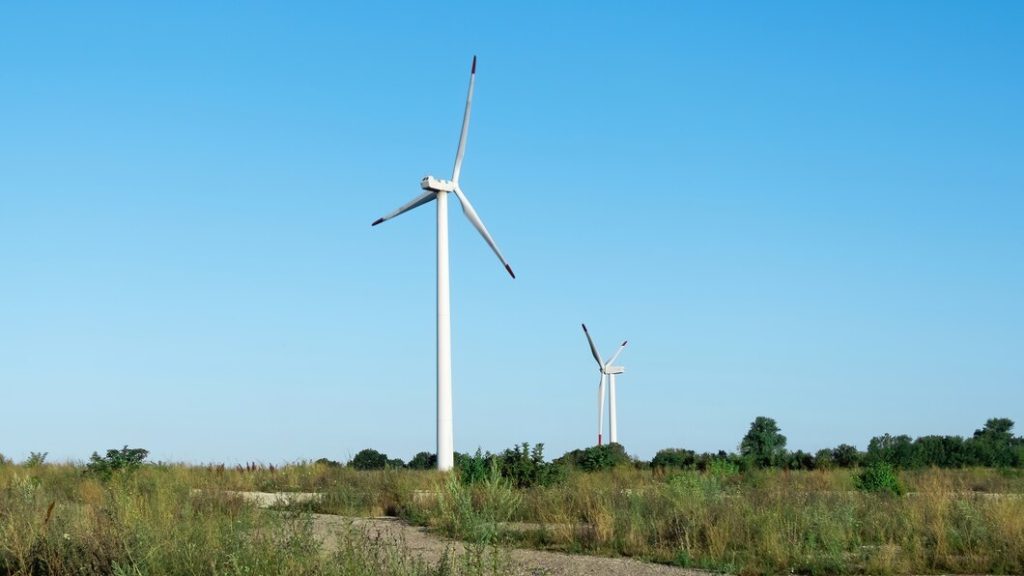 Cleaning Drone D15R 8 modern wind turbines against blue sky 1268 15648